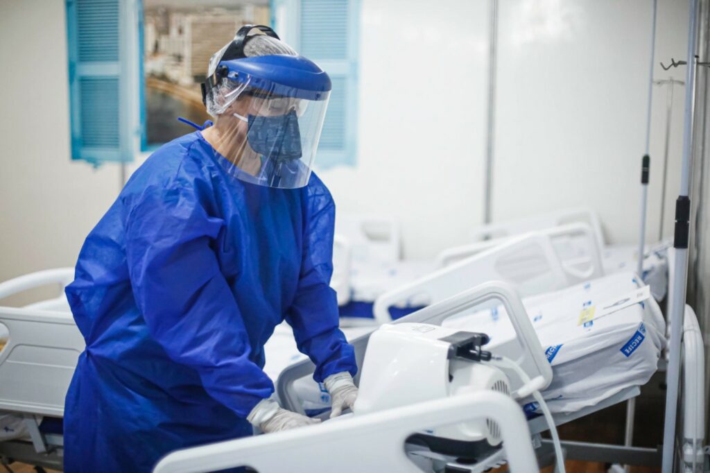 Female dentist in protective wear