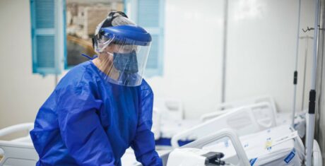Female dentist in protective wear
