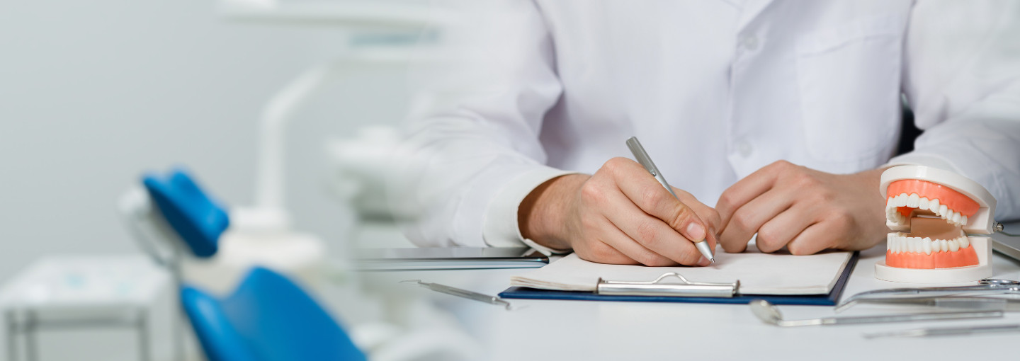 Dentist taking patient history